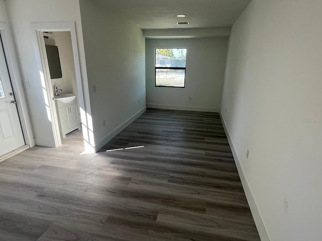 interior space with hardwood / wood-style floors and sink