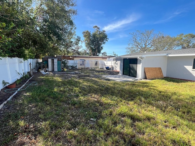 rear view of house featuring a yard