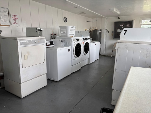 shared laundry area with independent washer and dryer