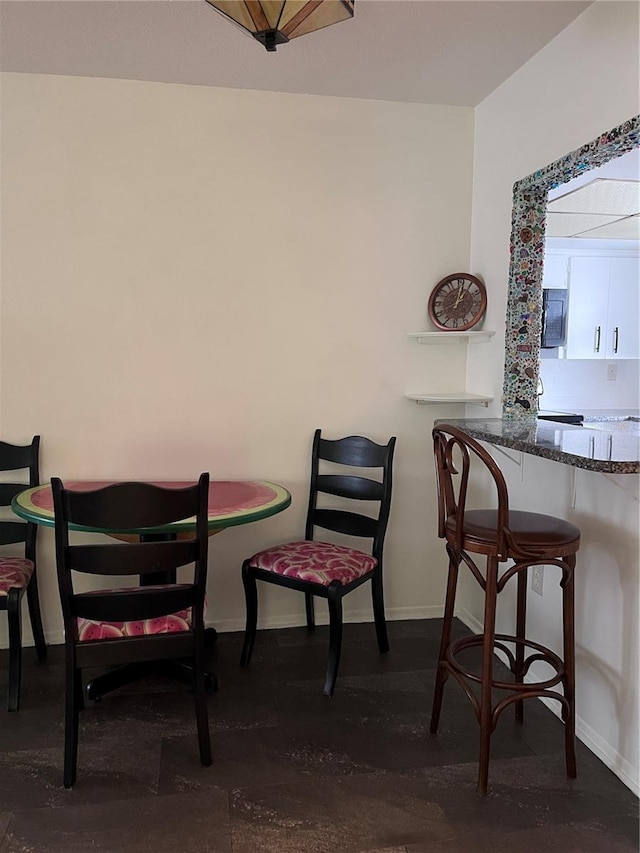 dining room with baseboards