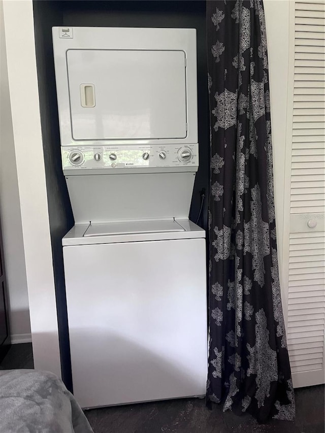 laundry room featuring stacked washer / dryer