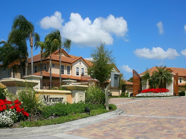 8133 Miramar Way Unit 201, Lakewood Ranch, FL 34202 - view of front of property with stucco siding and a tile roof