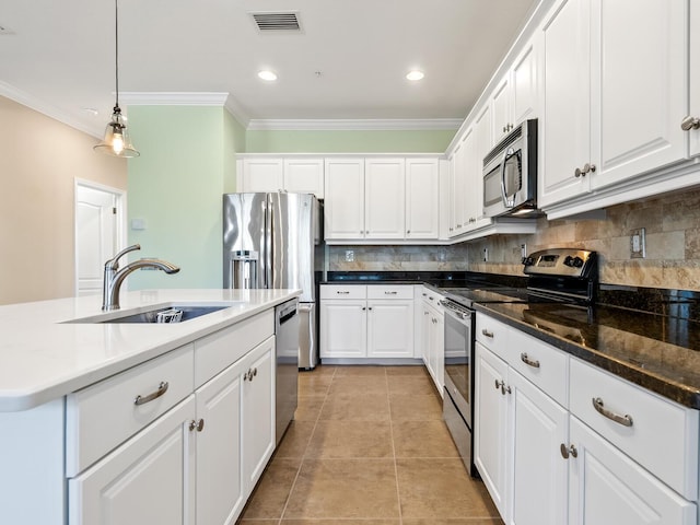 8133 Miramar Way Unit 201, Lakewood Ranch, FL 34202 - kitchen featuring appliances with stainless steel finishes, ornamental molding, white cabinetry, backsplash, and pendant lighting