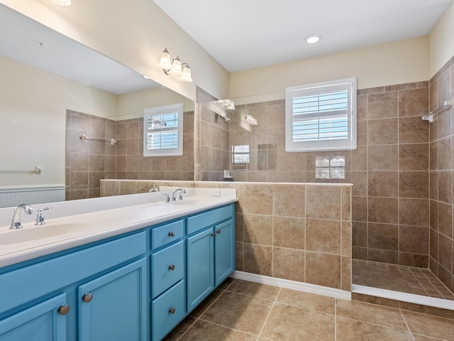 8133 Miramar Way Unit 201, Lakewood Ranch, FL 34202 - full bath featuring walk in shower, double vanity, tile patterned flooring, and tile walls
