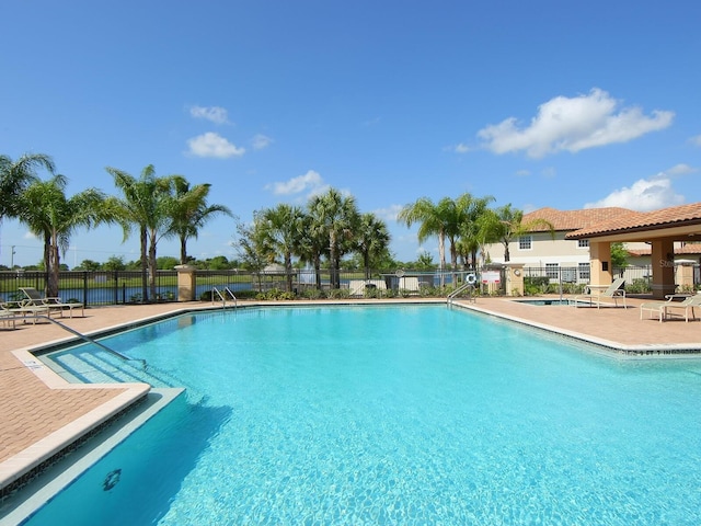 8133 Miramar Way Unit 201, Lakewood Ranch, FL 34202 - community pool featuring a patio