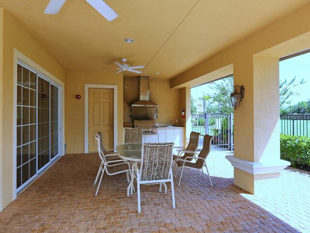 8133 Miramar Way Unit 201, Lakewood Ranch, FL 34202 - view of patio / terrace featuring a ceiling fan, exterior kitchen, and outdoor dining space