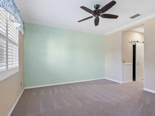 8133 Miramar Way Unit 201, Lakewood Ranch, FL 34202 - carpeted empty room with a barn door, a ceiling fan, and crown molding