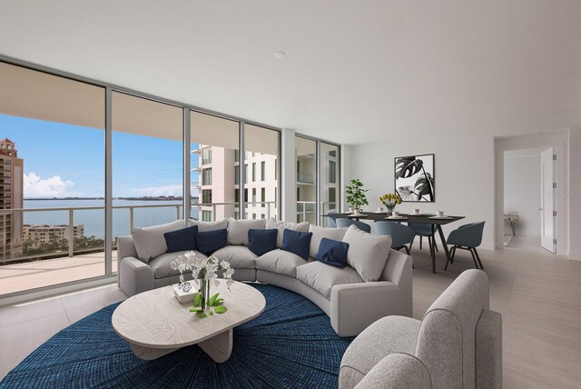 301 Quay Commons Unit 1111, Sarasota, FL 34236 - living area featuring a water view and floor to ceiling windows