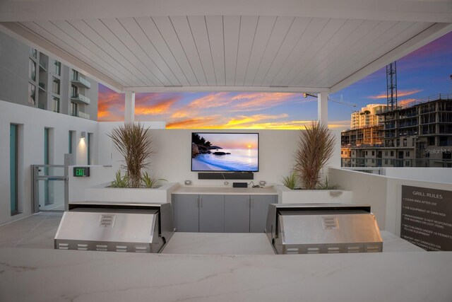 301 Quay Commons Unit 1111, Sarasota, FL 34236 - view of patio featuring an outdoor kitchen