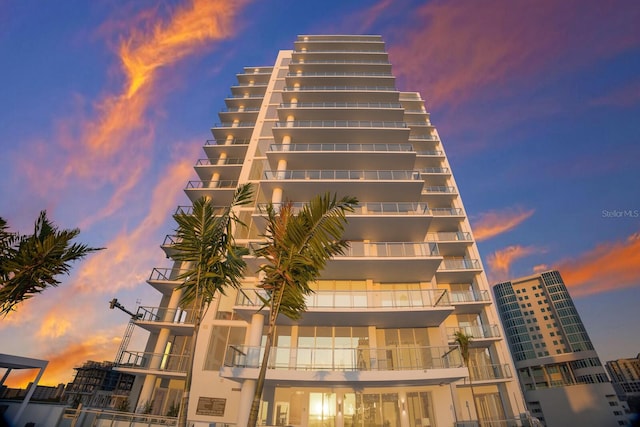 view of outdoor building at dusk