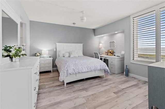 bedroom featuring ceiling fan and light wood-type flooring