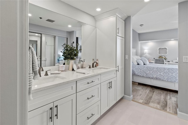 bathroom featuring hardwood / wood-style floors and vanity