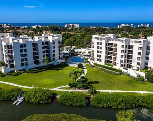 birds eye view of property featuring a water view