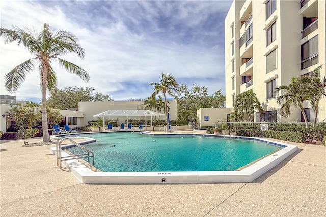 view of swimming pool featuring a patio area