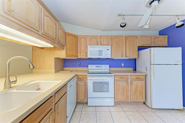 kitchen featuring light brown cabinets, lofted ceiling, white appliances, sink, and a textured ceiling