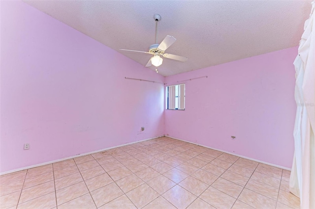 unfurnished room with ceiling fan, lofted ceiling, and a textured ceiling