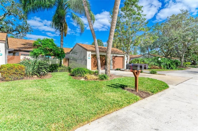 view of front facade with a front lawn and a garage