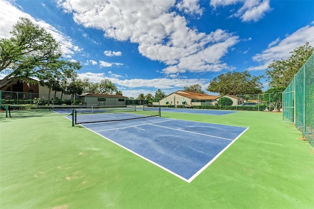 view of sport court featuring basketball hoop