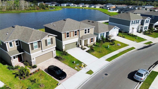 birds eye view of property featuring a water view