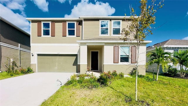 view of front of home with a garage and a front lawn