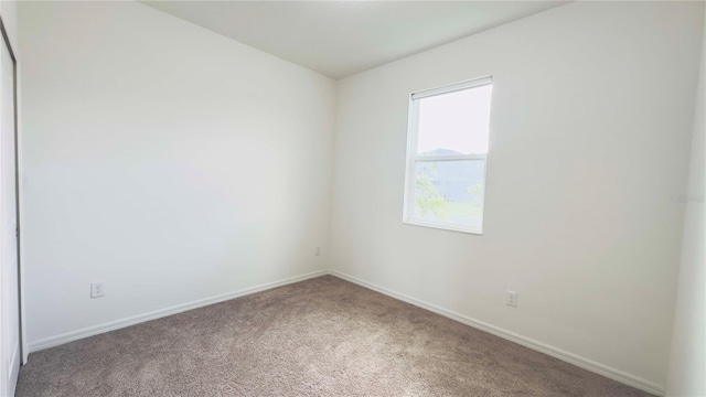 empty room with carpet flooring