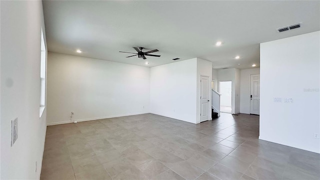 unfurnished room with ceiling fan