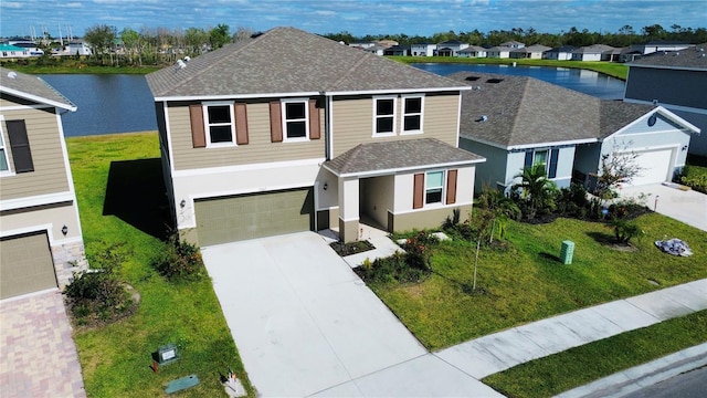 view of front of home featuring a water view and a garage