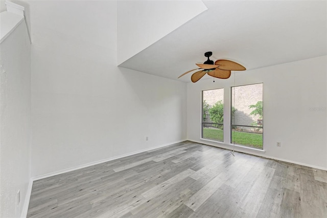 unfurnished room with light wood-type flooring and ceiling fan