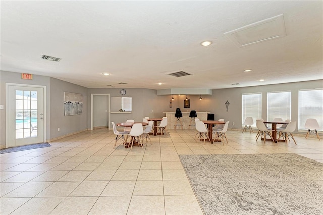 dining room featuring light tile patterned flooring