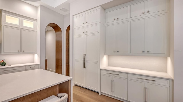 kitchen featuring white cabinets and light hardwood / wood-style floors