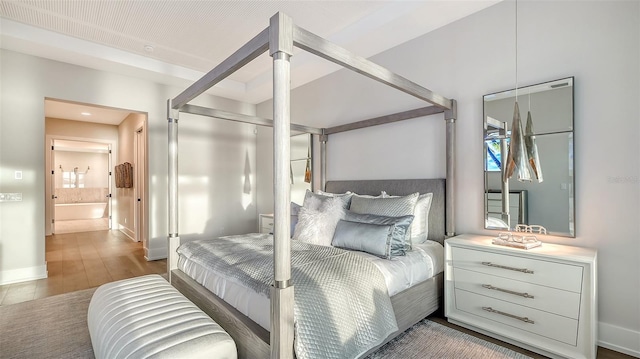 bedroom with wood-type flooring