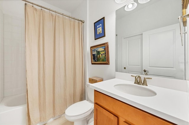 full bathroom with vanity, toilet, and shower / tub combo