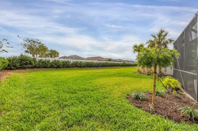 view of yard with a lanai