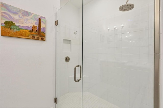 bathroom with a shower stall