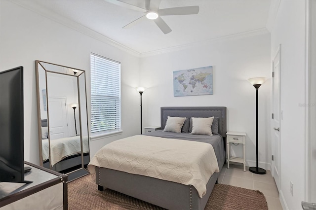 bedroom featuring ornamental molding, multiple windows, a ceiling fan, light tile patterned floors, and baseboards