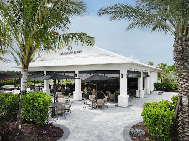 view of patio with outdoor dining space and a gazebo