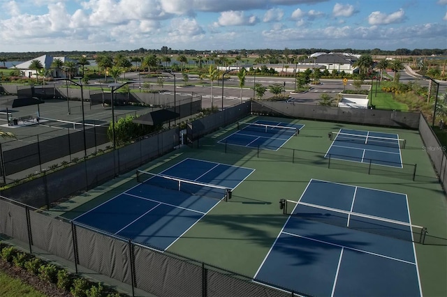 view of tennis court with fence