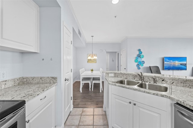 kitchen with white cabinets, dishwasher, ornamental molding, and sink