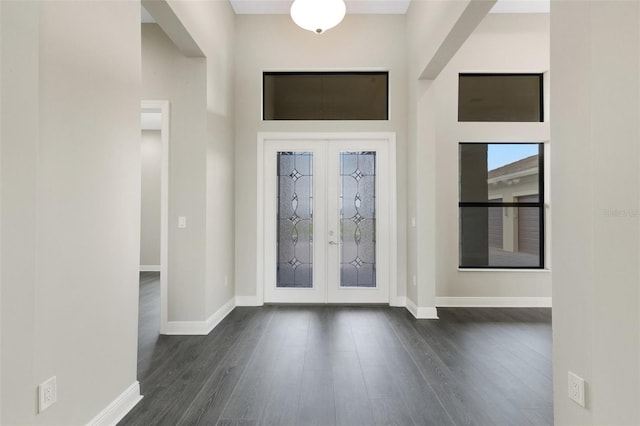 entrance foyer featuring french doors and dark hardwood / wood-style floors