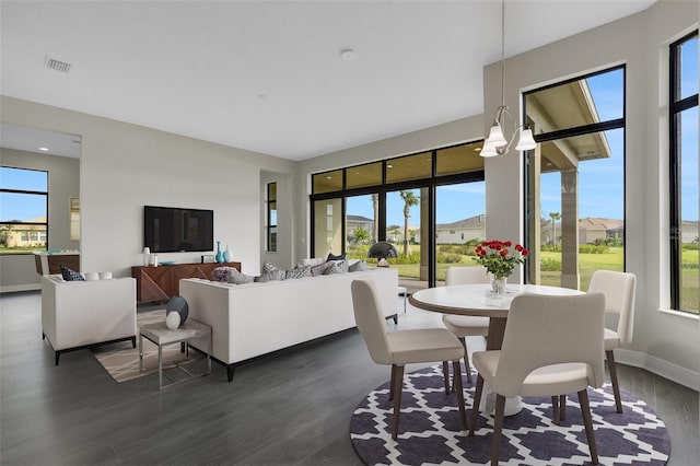 dining area with dark hardwood / wood-style floors