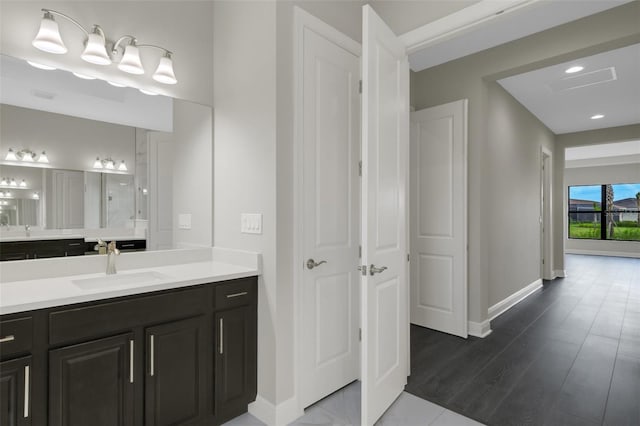 bathroom with vanity and hardwood / wood-style flooring