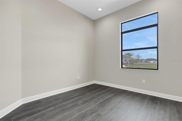 unfurnished room featuring dark hardwood / wood-style floors