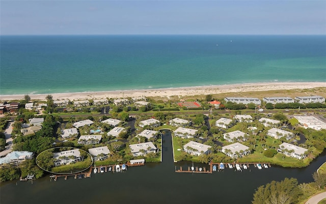 aerial view featuring a water view and a view of the beach