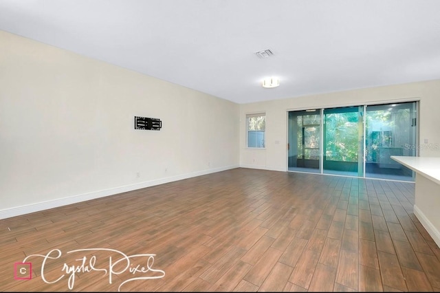 empty room with wood-type flooring