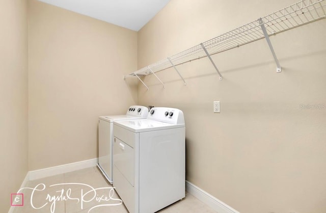 clothes washing area with independent washer and dryer