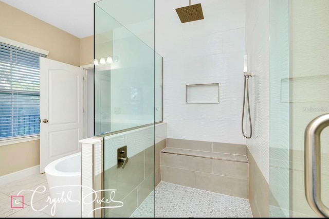 bathroom featuring tile patterned floors and shower with separate bathtub