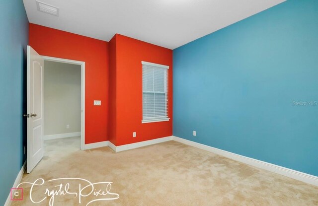 empty room with light colored carpet