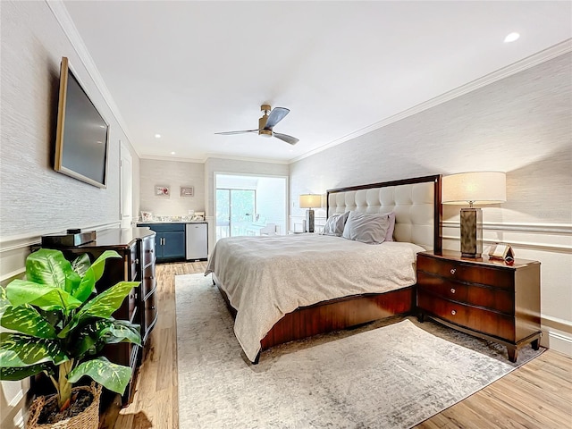 bedroom with ceiling fan, light hardwood / wood-style flooring, and crown molding