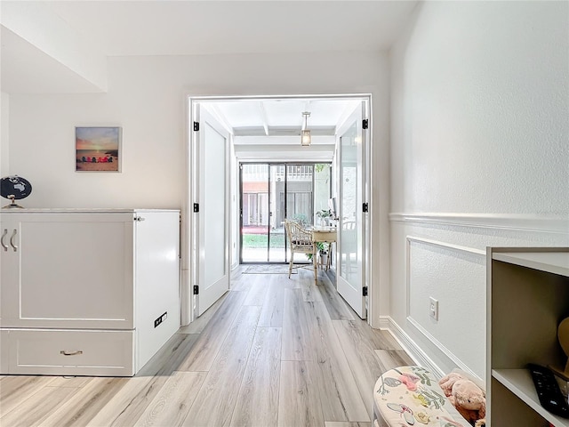 doorway to outside with light hardwood / wood-style floors