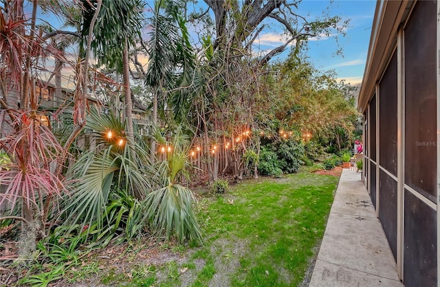 view of yard at dusk